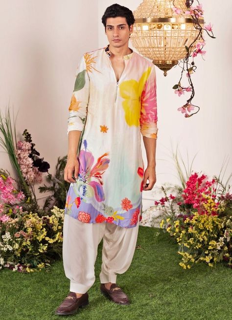 Check out these stunning and fresh tropical-themed outfits for grooms, from pastel bandhgalas to unique floral kurtas. Perfect for your exotic wedding! Hand Printed Kurta For Men, Men Mehendi Outfits, Mens Mehendi Outfits, Haldi Kurta For Groom, Mehendi Outfit For Groom, Haldi Outfits Men, Haldi Outfits For Groom, Mehendi Outfits For Men, Men Printed Kurta