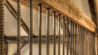 Vertical Rebar Baluster With Wood Beam Rails | Deck Railing Ideas ... Rebar Railing, Front Porch Railings, Patio Railing, Deck Railing Design, Railing Ideas, Building A Porch, Wood Railing, Rustic Porch, Deck Railing