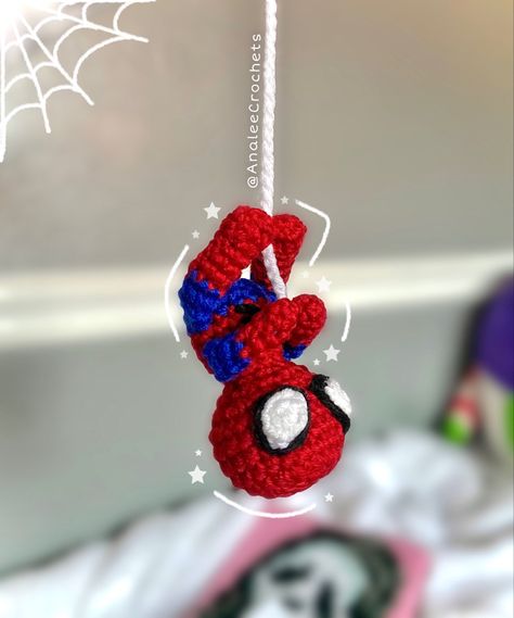 Crochet spiderman. Hanging upside down from a crochet spiderweb. Crochet Spider Man Amigurumi, Crochet Flowers Spiderman, Crochet Ideas Small Yarn, Spider Man Crochet For Car, Mini Crochet Spiderman, Spider Man Crochet Projects, Crochet Hanging Spiderman Pattern, Hanging Spider-man Crochet, Spiderman Sewing Pattern