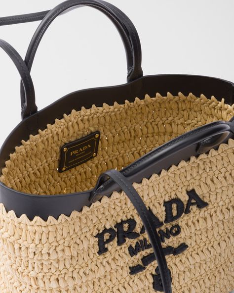 Raffia-effect yarn Double leather handles for use as a handbag or shoulder bag Metal hardware Embroidered lettering logo Unlined interior Embroidered Lettering, Prada Tote Bag, Prada Logo, Crochet Tote Bag, Lettering Logo, Woven Tote Bag, Crochet Tote, Manado, Leather Handles