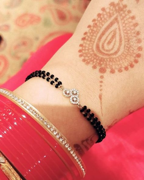 5 Gorgeous Mangalsutra Bracelets We Spotted On Instagram! Hand Mangalsutra, Mangalsutra Bracelet, Black Beads Mangalsutra, Indian Jewelry Earrings, Diamond Mangalsutra, Black Beads Mangalsutra Design, Diamond Pendants Designs, Gold Mangalsutra Designs, Black Beaded Bracelets