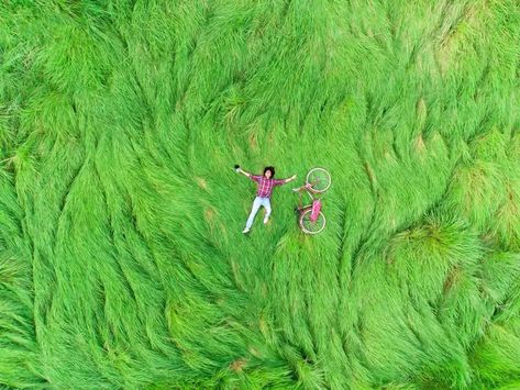 A Person Lying In A Field Of Grass With Bicycle#pikbest##Photo Person Lying Down Reference, Lying In A Field, Bicycle Photo, Grass Drawing, Grassy Hill, Foto Inspo, Merch Ideas, Landscape Concept, Grass Field