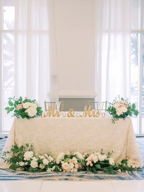 Timeless Romantic Sweetheart Table with Ivory Floral Linen, Lush Greenery and White, Blush Pink Roses and Hydrangeas, Gold Mr and Mrs Table Sign, Chiavari Chairs | Tampa Bay Wedding Planner Special Moments Event Planning | Wedding Rentals Kate Ryan Event Rentals | Wedding Venue Hyatt Regency Clearwater Beach Wedding Floral Arrangements Sweetheart Table, Blush Pink Sweetheart Table, Couple Head Table Wedding, Sweetheart Table Wedding Mr And Mrs Sign, Sweetheart Table With Sign, Wedding Decor Sweetheart Table, Bride And Groom Table Decorations Simple, Bridge And Groom Table, Rectangular Sweetheart Table Wedding