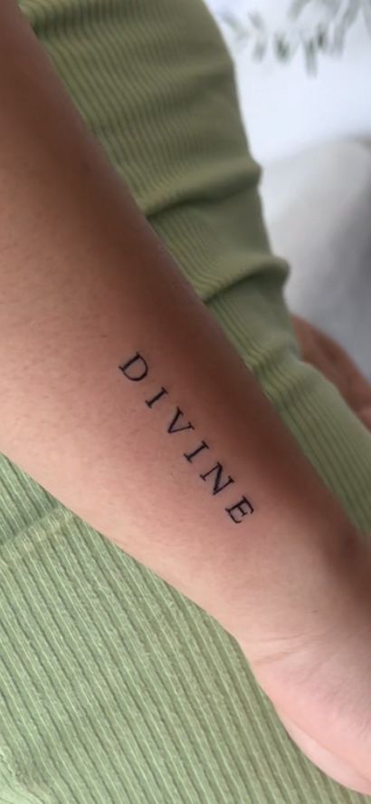 Divinity Tattoo Word, Minimalist Tattoo Quotes Words, Minimalist Word Tattoo Ideas, Word Divine Tattoo, Divine Font Tattoo, Angel Tattoo Quotes, Tiny Text Tattoo, Pretty Word Tattoos, Divine Back Tattoo