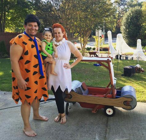 Flintstones family costume! Fred, Wilma, Pebbles, and the flinstones car.  Converted my LOs wagon using Sono tubes, 1x2's, drop cloth, and card board. #Yabadabado #Flintstones #Flintstonescar Wagon Halloween Costumes, Flintstones Halloween Costumes, Flintstones Costume, Costume Homemade, Family Costumes Diy, Pebbles Costume, Car Costume, Halloween Costumes Diy, Cartoon Costumes