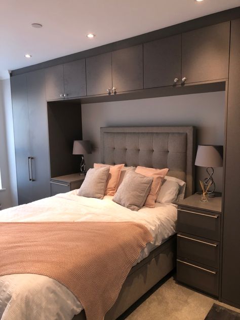 Are you looking for a fitted wardrobe that makes a statement? This is an anthracite linen finish that real does make a huge impact in this bedroom whilst creating plenty of storage space around the bed. Wardrobe With Bed Design, Wardrobe Design Bedroom With Bed, Wardrobes Over The Bed, Wardrobe Bed Design, Bedroom Wardrobe For Small Rooms, Built In Wardrobe With Bed, Wardrobe In Small Room, Bed Wardrobe Design Modern, Bedroom Wardrobe With Bed