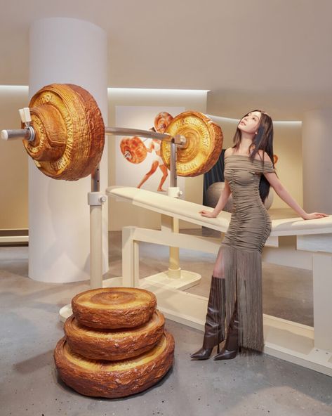 Gentle Monster revamps Haus Shanghai with installations and a croissant gym Food Installation, Croissant Shop, Futuristic Supermarket, Gentle Monster Store Design, Gentle Monster Store, Croissant Art, Futuristic Cafe Interior Design, Gentle Monster Exhibition, Gentle Monster Installation