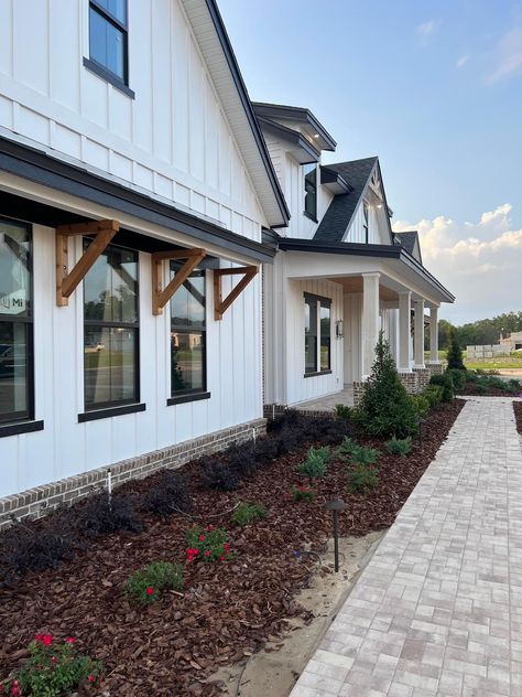 Exterior Board And Batten Wall, Black Fascia White Soffit, White Siding Black Windows, Farmhouse Siding, Brick And Board And Batten Exterior, Barndominium Exterior, Farmhouse Reno, Hastings House, White Siding