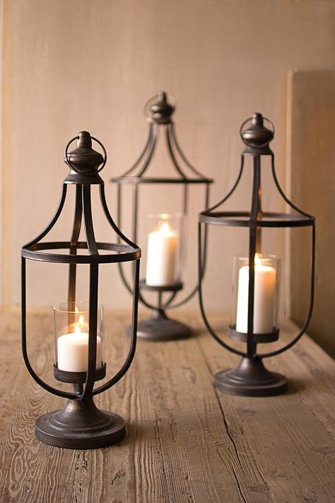 Rustic Metal Candle Lanterns - Set Of 3 Featuring a classic lantern shape, this set of three metal candle holders are the perfect place to display candles or strands of lights. #homedecor #lantern #interiordesign #decor #candleholder #candleholders #candlesofinstagram #homeaccessories #candle #candles #instagood