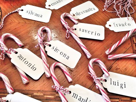 Diy place cards with candy canes Christmas Table Name Placements, Christmas Place Names Diy, Christmas Dinner Party Decorations Place Settings Name Cards, Candy Cane Wedding Favors, Candy Cane Place Cards, Christmas Place Name Ideas, Name Place Cards Christmas, Christmas Wedding Name Cards, Diy Christmas Name Place Cards