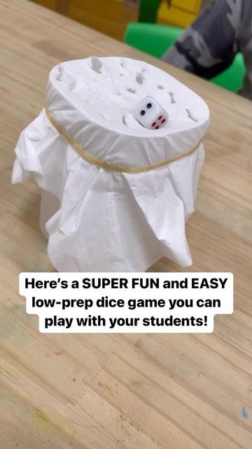 Alea on Instagram: "Here’s a SUPER fun and easy dice game you can play with you students in a small group. I call it dICE breaker — you’ll see why! 😜 You just need: -a cup -a tissue paper -a rubber band -2 dice -a pencil Secure the tissue paper over the cup with a rubber band, then put one of the dice on top. To play, have a student read/answer a question on whatever topic you guys are covering at the moment. Then, that student will roll other the dice. Whatever number shows is the number of Roll The Dice Break The Ice, Water Cup Game, Punch A Cup Game Tissue Paper, Grinch Games, Dice Game Rules, Dice Math Games, Resident Activities, 10 Sided Dice, Classroom Party Ideas