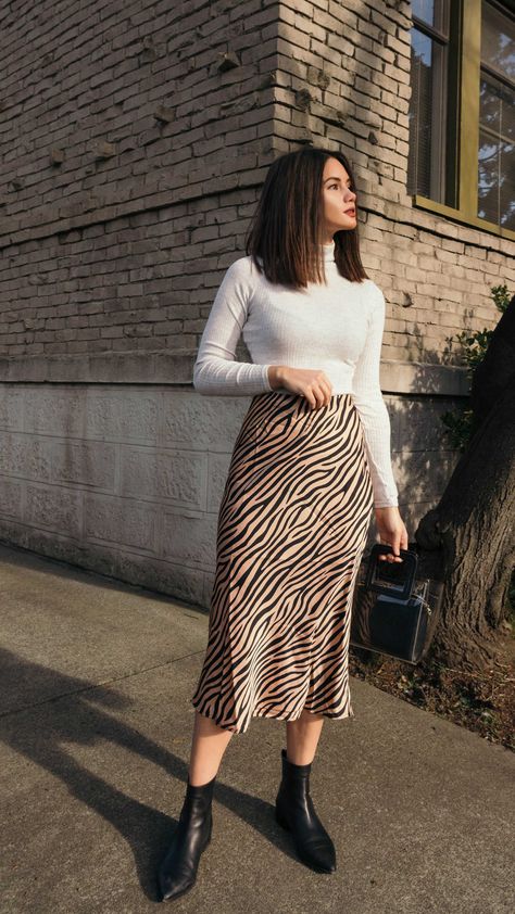 Tiger Print Midi Skirt. Click to shop this outfit. Work Outfits Women Midi Skirt, Skirts And Long Sleeves Outfits, H&m Skirts Outfit, Skirt And Top Styling, Skirts Autumn Outfit, Skirt Outfits Ideas Casual, Long Skirt Outfits For Office, Winter Outfits Skirt Midi, Midi Skirt For Fall