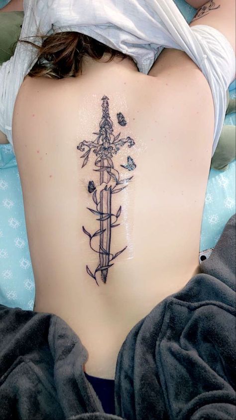 Sword with vines and butterflies Back Vine Tattoo, Butterfly With Vines Tattoo, Vine Back Tattoo, Dagger Spine Tattoo, Beautiful Back Tattoos, Flower Vine Tattoos, Flower Spine Tattoos, Butterfly Back Tattoo, Remembrance Tattoos