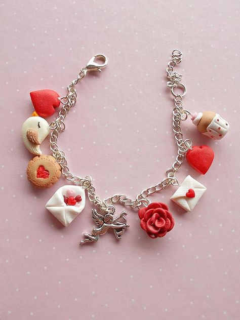 Adjustable Valentine's Day bracelet created from polymer clay with charms: love letter, rose, Cupid, envelope with red and pink hearts, bird, lovely muffin and the red heart charm. The bracelet is fully adjustable and can be worn by adults and children as well. Make Things With Clay, Clay Charm Bracelet Ideas, Clay Charms Bracelet, Clay Valentine, Polymer Clay Bracelets Diy, Valentine's Day Charm Bracelet, Clay Charm Bracelet, Bracelet Charm, Bracelet With Charms