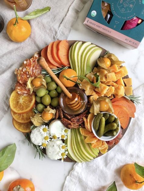 Looking for an impressive charcuterie board idea or cheese platter for your friends and family this holiday season? Try this board made with fresh fruits, meats, cheeses, and of course our Brazilian Quince Honey - Marmeleiro by Bee Seasonal. This platter is great for feeding a crowd during Christmas, Thanksgiving or the holidays! #charcuterieideas #cheeseboard #cheeseplatter #beeseasonal #beeseasonalhoney Recipes With Honey, Honey Gift Basket, Yogi Food, Cheese And Honey, Beautiful Cheese Board, Last Holiday, Honey Gifts, Creative Recipes, Charcuterie Inspiration