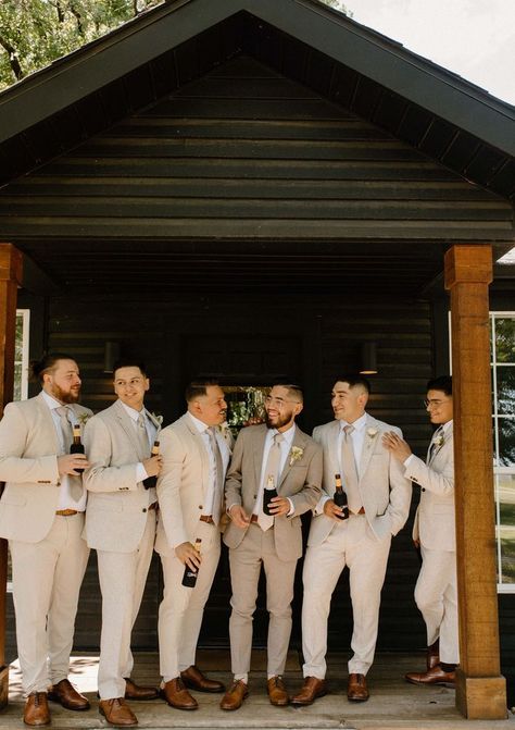 Tan Suit Groom And Groomsmen, Suits For The Groom Wedding Day, Taupe Mens Wedding Attire, Groomsmen No Tie With Jacket, Small Wedding Groom Outfit, Neutral Bridal Party Groomsmen, Tan Suit Groomsmen Groom Attire, Beige Tuxedo Wedding Groomsmen, Olive And Tan Wedding Party