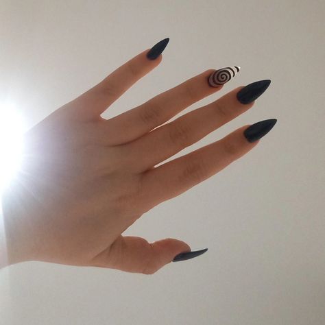 a white hand against a beige background, with medium pointed black acrylic nails. the ring finger of each hand has a black spiral design across the nail, on a nude polish background Emo Nail, Soft Grunge Nails, Simple Nail Design, Wow Nails, Gothic Emo, Grunge Nails, Simple Nail, Acrylic Nail Art, Simple Nail Designs