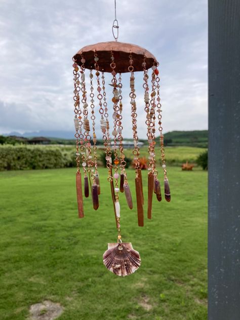 Hammered copper jellyfish with shells, beads, urchin spines Jellyfish Windchime, Hammered Copper, Jellyfish, Wind Chimes, Stained Glass, Stain, Shells, Copper, Brass