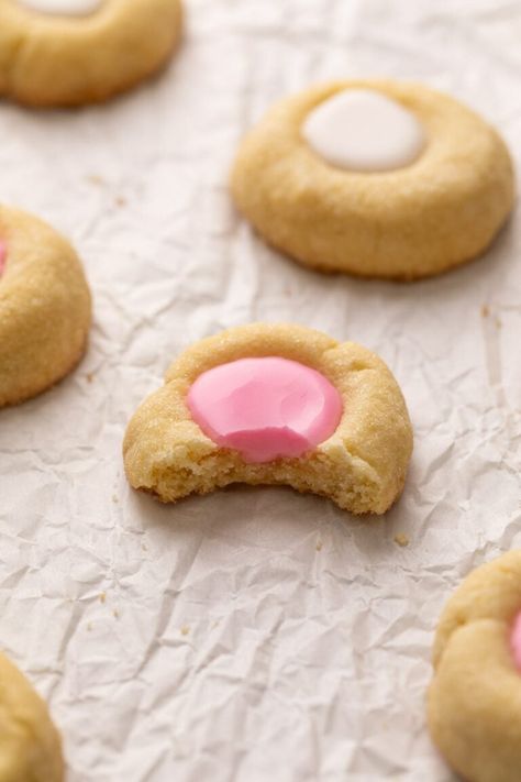 These classic and easy thumbprint cookies with an icing filling are a simple recipe for melt-in-your-mouth cookies that are perfect for all occasions! Icing Thumbprint Cookies, Cookies With Icing In The Middle, Thumbprint Icing Recipe, Thumb Cookies, Iced Thumbprint Cookies, Easy Thumbprint Cookies, Thumbprint Cookies With Icing, Best Thumbprint Cookies, Thumbprint Cookies Easy