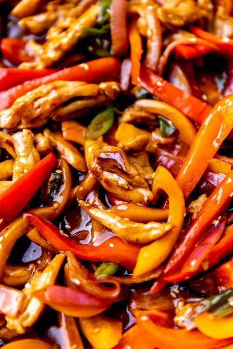 A Chinese takeout classic lightened up at home, this Orange Chicken Stir Fry is loaded with juicy stir-fried chicken (no deep frying required!) & tender-crisp bell peppers & onions. Toss it all together in a savory-sweet orange stir fry sauce, then serve over rice for a quick & healthy dinner that satisfies any takeout cravings. Completely homemade & ready in 30 minutes or less! #orangechicken #orangechickenstirfry #easyorangechicken #healthyorangechicken #dinnerideas #easydinnerrecipes Orange Stir Fry, Chicken Peppers And Onions, Orange Chicken Stir Fry, Healthy Orange Chicken, Easy Orange Chicken, Serve Over Rice, Stir Fry Recipes Chicken, Orange Chicken Recipe, Quick Healthy Dinner