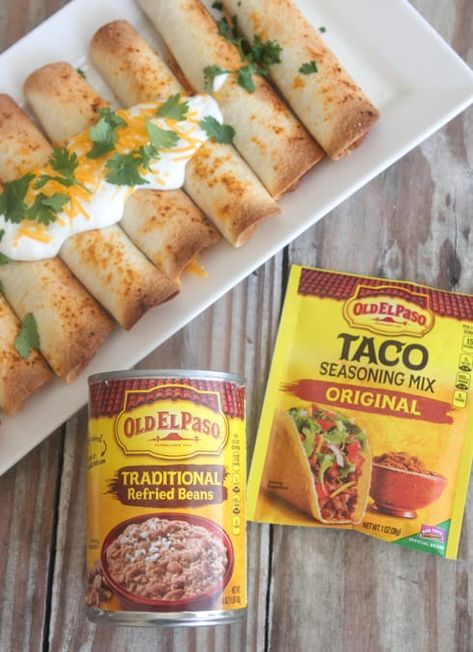 Bean and Cheese Baked Taquitos - Picky Palate Bean And Cheese Taquitos, Easy Taquitos, Bean Taquitos, Cheese Taquitos, Homemade Taquitos, Recipe With Cheese, Traditional Refried Beans, Baked Taquitos, Fiesta Food