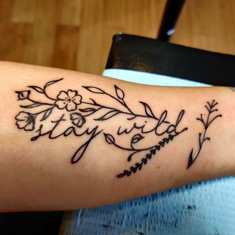 Get Rowdy Tattoo, Country Tattoos For Women Thigh, Wild As Her Tattoo, Small Country Tattoo Ideas, Punchy Western Tattoo Ideas, Women Tattoos Western, Cute Tattoos Western, Cowboy Up Tattoo Ideas, Stay Wild Tattoo With Flowers