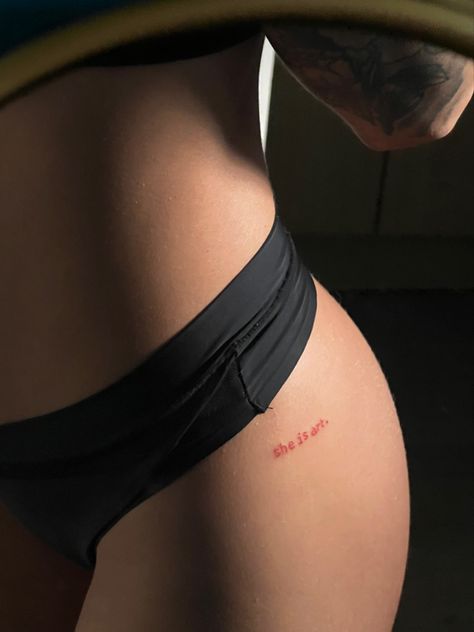 Cute Red Ink Tattoos, Red Ink Hip Tattoo, She Is Tattoo, Small Breast Tattoo, She Is Art Tattoo Ideas, Spicy Tattoo Ideas, Red Word Tattoo, Tattoo Ideas Red Ink, Red Tattoos For Women