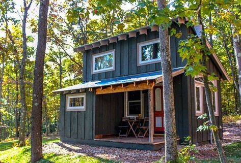 This is a 400 sq. ft. Walden Tiny House by Hobbitat Spaces. They sell the plans you can purchase and download to build it yourself or have a contractor do it for you. One of the few Hobs with 2 ext… Houses In The Woods, Small Cabin In The Woods, Tiny House Plan, Tiny Cabins, Tiny Cabin, Tiny House Movement, Tiny House Cabin, Small Cabin, Small Houses