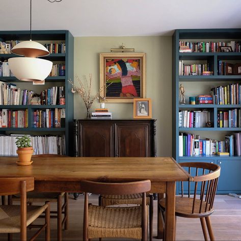 A stunning image of the Asian colonial style where east meets west- a Philippine colonial altar table interspersed with a French country dining table and mid-century chairs, set below contemporary lighting and artwork. Mid Century Colonial Decor, Colonial Mid Century Modern, Spanish Colonial Dining Room, Mid Century Colonial, Room With Bookshelves, Country Dining Table, French Country Dining Table, French Country Dining, Country Dining