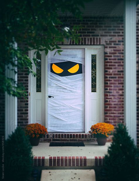 Spooky Halloween Door Wrapped Up As Mummy by sjlocke | Stocksy United Porta Halloween, Halloween Decorations Outdoor Porch, Halloween Front Door Decorations, Cheap Diy Halloween Decorations, Cheap Halloween Decorations, Halloween Diy Outdoor, Halloween Decor Diy, Photo Halloween, Halloween Front Doors