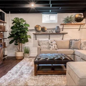 Finished Basement Tv Area, Simple Basement Remodel Budget, Easy Basement Renovation, Relaxing Basement Ideas, Realistic Basement Ideas, Basement Boho Decor, Small Cozy Living Room Colors, Cement Block Basement Wall Ideas, Basement Bedroom Living Room Combo