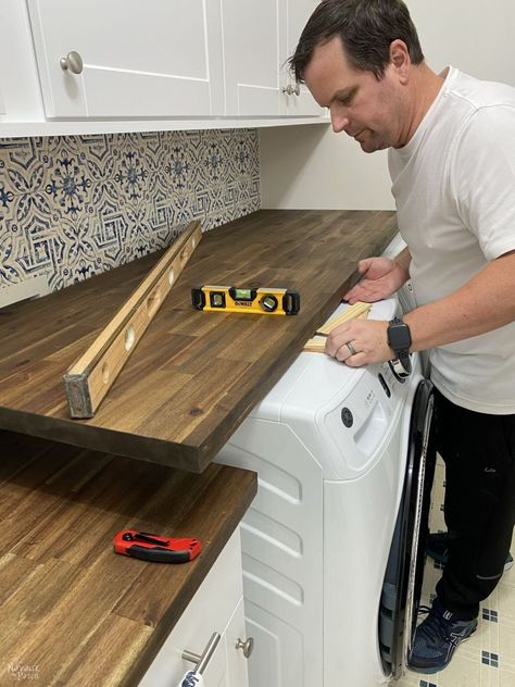 Butcher Board Laundry Room, Table Over Laundry Machine, Laundry Room Sink Ideas Counter Tops, Diy Wood Counter Top Laundry Room, Laundry Room Ideas Countertops, Laundry Room Ideas With Butcher Block, Wood Top Over Washer And Dryer, Hinged Countertop Laundry, Butcher Block Countertop In Laundry Room