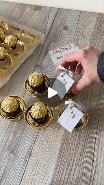 Rubbia on Instagram: "Chocolate Wedding Favours   #chocolatefavors #fyp #wedding #weddingday #weddingfavors #weddinginspiration #ideas #favors #partyfavors #ferrerorocher #personalised #gifts #minitreats #byrubbia #london #instadaily #instamood #giveaway" Chocolate Favours Wedding, Ferrero Rocher Wedding Favors, Chocolate Giveaways Ideas, Ferrero Rocher Favors, Diy Party Favors For Adults, Ferrero Rocher Gift Ideas, 50th Wedding Anniversary Favors, Ferrero Rocher Gift, Disney Wedding Favors