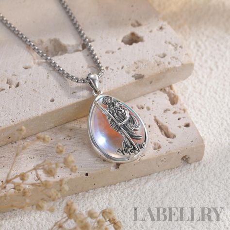 This stunning St. Christopher pendant necklace, handcrafted with 925 sterling silver and adorned with a Water drop Style Synthetic turquoise or Moonstone🌟.  The turquoise stone has long been appreciated for its believed protective and healing qualities, often representing loyalty, love, and strength 💙. Meanwhile, moonstone is thought to carry a sense of mysterious energy, linked to intuition, balance, and hope, as well as a connection to feminine energy. Many people feel that it's associated with the moon's cycles and may help enhance intuition, calm emotions, and support personal growth 💙. St. Christopher, the patron saint of travelers, offers protection and guidance, making this necklace an ideal gift for those embarking on new journeys or in need of spiritual safeguarding. 👫 UNISEX: