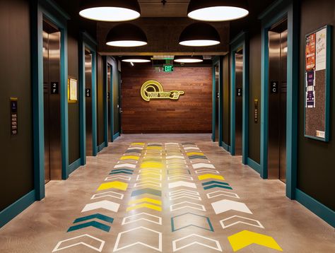 With directional arrows on the floor and wall, wayfinding makes it easy to know where the exit is. Floor Wayfinding, Floor Signage, Wayfinding Signage Design, Wayfinding Signs, Floor Graphics, Directional Signage, Way Finding, Wayfinding Design, Interior Architects