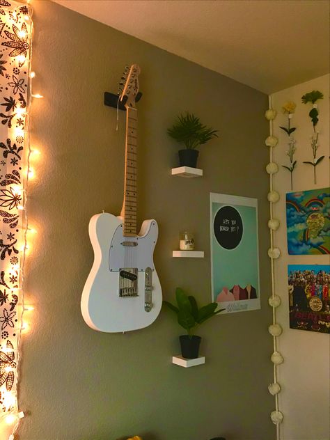 Mount Guitars On Wall, Room Guitar Aesthetic, Guitar Wall Mount Aesthetic, Wall Mounted Guitar Ideas, Guitar Wall Display Bedroom, Guitar Mounted On Wall Decor, Guitar Hanging Ideas Bedroom, Hanging Guitars On Wall Ideas Bedroom, Bedroom Guitar Setup