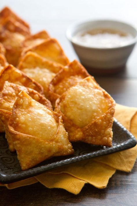 Creamy, crunchy and crabby... this Crab Rangoon recipe is an "oldie but goodie" appetizer recipe that's ready in under 30 minutes. #crab #crabrangoon #appetizer #easyappetizer Homemade Crab Rangoon, Seafood Appetizers Easy, Rangoon Recipe, Crab Rangoon Recipe, Crab Rangoon, Communal Table, Easy Seafood, Superbowl Snacks, Crab Recipes