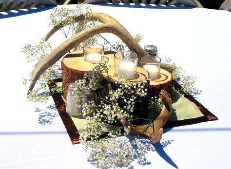 Western theme wedding, logs turned into candle holders with antler decor and baby breath. Hunting Theme Wedding Ideas, Antler Themed Wedding, Hunting Wedding Theme, Antler Centerpiece, Mountain Wedding Ideas, Antler Decor, Hunting Theme, Hunting Wedding, Hunting Themes