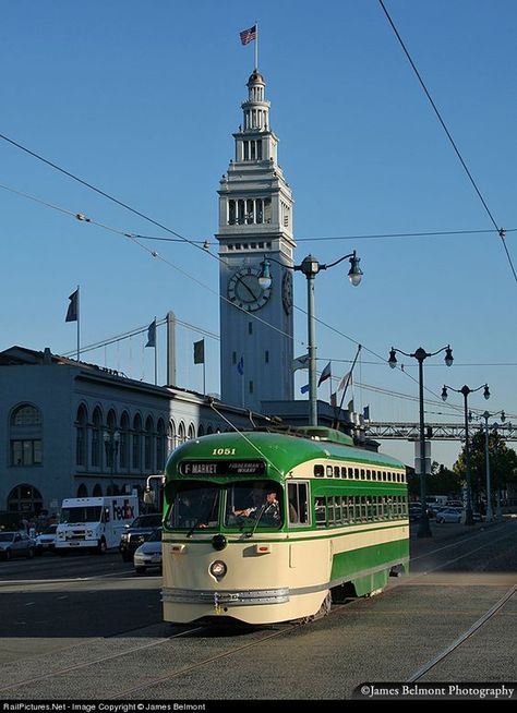 MUNI car 1051 heads west along the Embarcadero at the Ferry Building in San Francisco. This PCC streetcar was built by St. Louis Car Co. in 1948, and is painted to honor the San Francisco Municipal Railway (with the simplified 1960s livery).: San Francisco Photography, San Francisco Photos, Visit San Francisco, San Francisco City, Drone Photos, San Fran, California Dreaming, Street Cars, San Francisco Bay