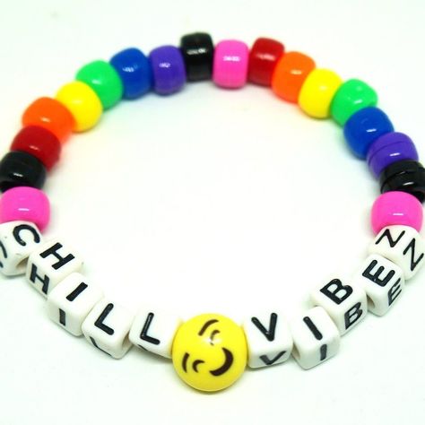 Rainbow Smiley Kandi Bracelet - Describes design and style 🌟 #EDCKnifeBeads #KnifeAccessories #EverydayCarry #EDC #GearCustomization #TacticalBeads #ParacordBeads #HandcraftedBeads #ArtisanBeads #KnifeCollecting #KnifeEnthusiast #GearUpgrade #UniqueBeads #FunctionalArt Kawaii Kandi, Festival Kandi, Scene Bracelets, Diy Kandi Bracelets, Edm Rave, Kandi Cuff, Healing Gemstone Bracelets, Word Bracelet, Kandi Bracelets