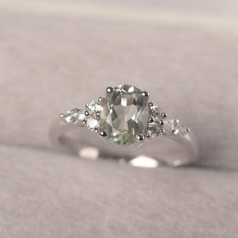 * The delicate ring displays green amethyst as main stone. The cluster side stones make the ring similar to the blooming flower . For who wearing this special & delicate ring, will shine like a goddess. ◆ Production Description: Main stone Type: Green Amethyst Main Stone Shape: Oval Cut Main Stone Size: 6*8mm (1.14ct) Side stone: CZ Metal: 925 Sterling silver - Other options available in the drop down menu ◆ Customization: √Free for Add Engraving √Other Metal Type Available √Other Gemstones Silver Green Ring, Gemstone Engagement Rings Silver, Green Amethyst Engagement Ring, Green Wedding Rings, Green Engagement Rings, Real Green, Cute Engagement Rings, Green Amethyst Ring, Silver Engagement Ring