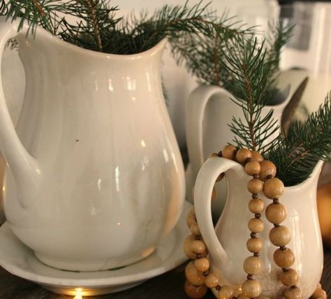 White Christmas decorated ironstone pitchers with fresh greenery in my home - Hello Lovely Studio. #hellolovelystudio #ironstone #christmasdecor White Pitchers, Scandi Christmas Decorations, Joy Wreath, Holiday China, Christmas Prayer, Christmas Vignettes, Neutral Christmas Decor, White Pitcher, Scandi Christmas