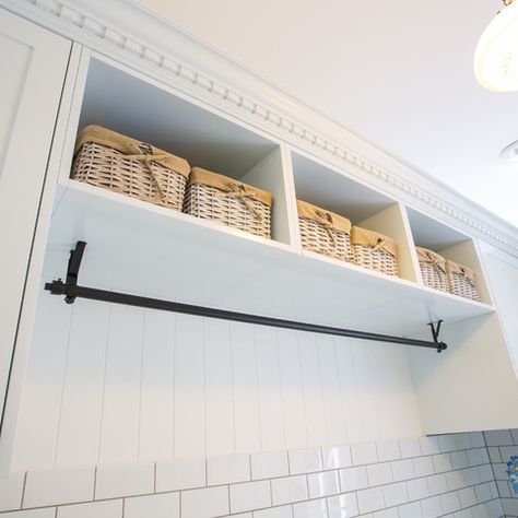 Bead board, nice hanging rod on top (high) and robe hooks underneath.  Cabinets on the sides?  Storage on top?  Built in bench with shoe storage underneath.  With washer and dryer stacked on one side... mud room and laundry room in a small space at it's most functional Laundry Room Hanging Bar Under Cabinet, Open Shelves Over Washer And Dryer, Laundry Cabinets With Hanging Rod, Mudroom With Hanging Rod, Cabinets Above Laundry, Laundry Room Cabinets With Hanging Rod, Laundry Room With Hanging Rod, Laundry Room Hanging Rod, Laundry Room Hanging Bar