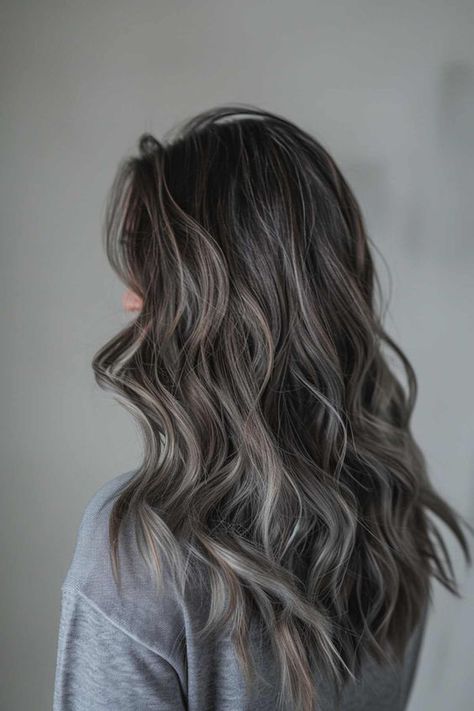 Save this pin for a stunning long wavy brunette with ash grey highlights! Feeling bored with your current hair color? Tap to see how these gorgeous highlights can add depth and dimension to your look, making you feel fabulous! Grey Hair Color Ideas For Brunettes, Dark Brunette Balayage Hair Ashy, Ash Grey Highlights On Brown Hair, Dark Hair Grey Coverage Ideas, Grey Brown Hair Balayage, Brunette Grey Hair, Adding Dimension To Dark Brown Hair, Ash Hair Color Grey, Icy Babylights