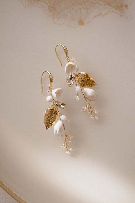 Discover the perfect finishing touch for your bridal look with our collection of stunning wedding earrings. Elevate your style on your big day with our elegant and timeless designs. Shop now to find the perfect pair to complement your wedding dress. White Dangle Earrings For Wedding Gift, White Pearl Drop Clip-on Earrings For Wedding, Elegant Jewelry For Marriage With Matching Earrings, Dainty White Dangle Bridal Earrings, White Crystal Earrings With Elegant Design For Gift, Teardrop Clip-on Earrings For Wedding, Delicate Teardrop Flower Earrings For Weddings, Wedding Teardrop Clip-on Earrings, Elegant Wedding Cluster Earrings With Ear Wire