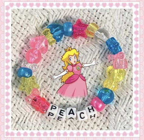 Mario Bracelet Pattern, Princess Peach Bracelet, Kandi Bracelets Anime, Kandi Inspo Single, Kirby Bracelet, Single Kandi Ideas, Mario Bracelet, Mario Kandi, Kandi Ideas Singles