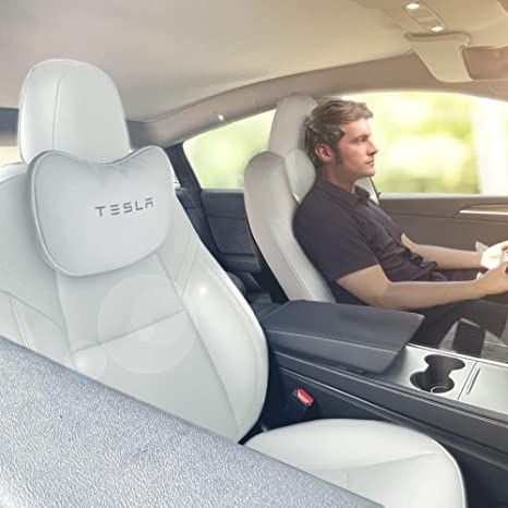 This product is a headrest pillow designed specifically for use in a Tesla car. It is made with memory foam and covered in high-quality leather for comfortable and durable use. The design is uniquely tailored to fit the shape of Tesla's headrests, providing additional support and comfort for passengers during long rides. It comes in a stylish black color that complements the interior of Tesla cars. Tesla Model 3 Accessories, Tesla Interior, Tesla Car, Tesla Model Y, Leather Wear, Tesla Model 3, Neck Support, Car Interior Decor, Car Girl