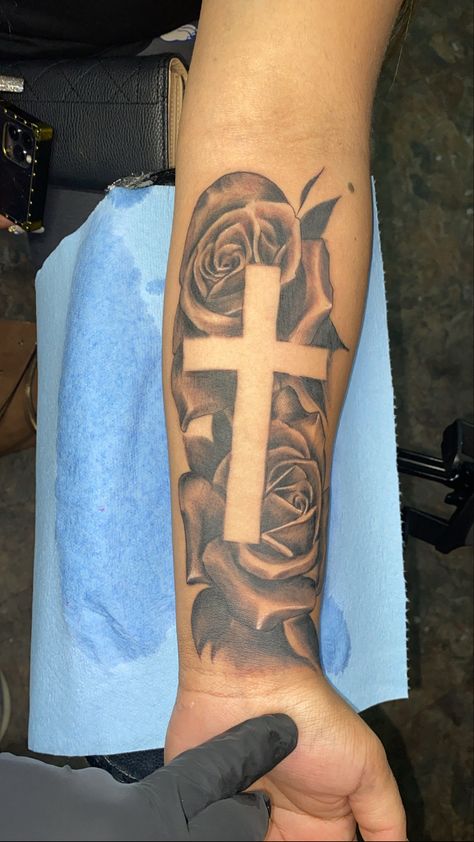 Cross Forearm Tattoo Men Half Sleeves, Tattoo Designs Men Cross, Cross With Flowers Tattoo Men, Cross With Names Tattoo Design, Cross Bicep Tattoo Men, Cross With Name Tattoo, Rose Tattoo With Cross, Tattoos For Guys Cross, Mens Rose Tattoo Forearm