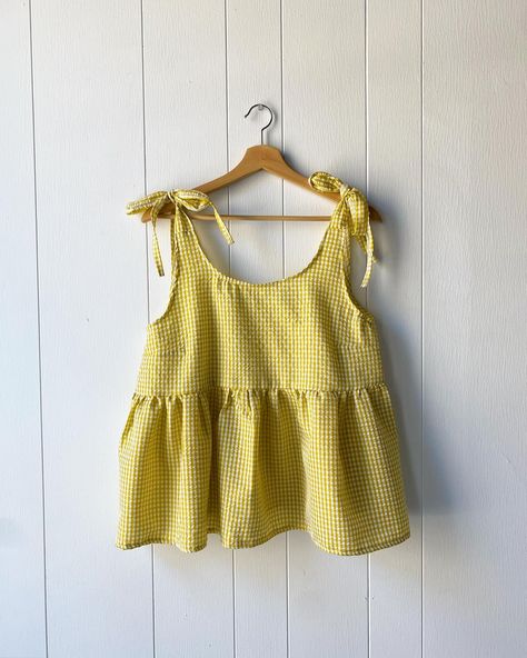 A little blast of sunshine 🌞 the Chloe Top in a bright gingham seersucker! Find it first at the Pop Up on Sunday, April 14th @luckygirlpopup 🌻 #luckygirlpopup #shopsmallcanada #handmadeclothing #slowfashion #slowsewing #shopsmall #shoplocal #smallbatchfashion #smallbatchclothing #springtop #ginghamtop Diy Top Design, Tops Patterns Sewing, How To Sew A Babydoll Top, Simple Tops To Sew, Cute Top Pattern, How To Sew Babydoll Top, Cute Sewing Projects Clothes, Sewing Babydoll Top, Sewn Clothes