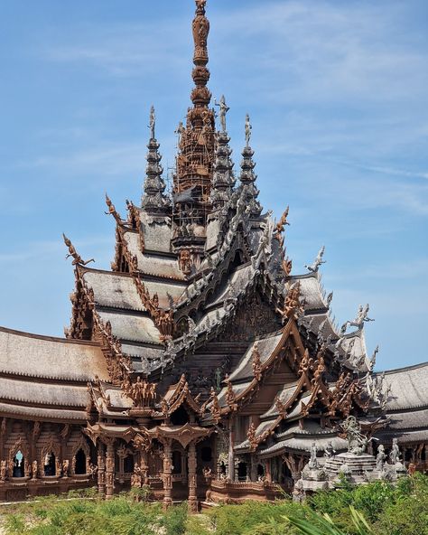 Thailand's remarkable Sanctuary of Truth Museum: ALL wood and NO nails! Towering over the shores of Pattaya, this Thai temple is a marvel of intricate wooden architecture that left us completely awestruck. This unfinished museum, the brainchild of Thai businessman Lek Viriyaphan, is a unique blend of temple and castle, inspired by Ayutthaya Kingdom, Buddhist, and Hindu philosophies. The Sanctuary's construction began in 1981, and despite being unfinished, it has become an iconic landmark of ... Thai Temple Architecture, Sanctuary Of Truth, Thailand Temple, Thai Architecture, Thailand Country, Temple Thailand, Thai Temple, Thailand Art, Wooden Architecture